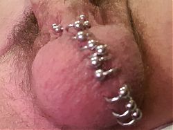 Cock piercing